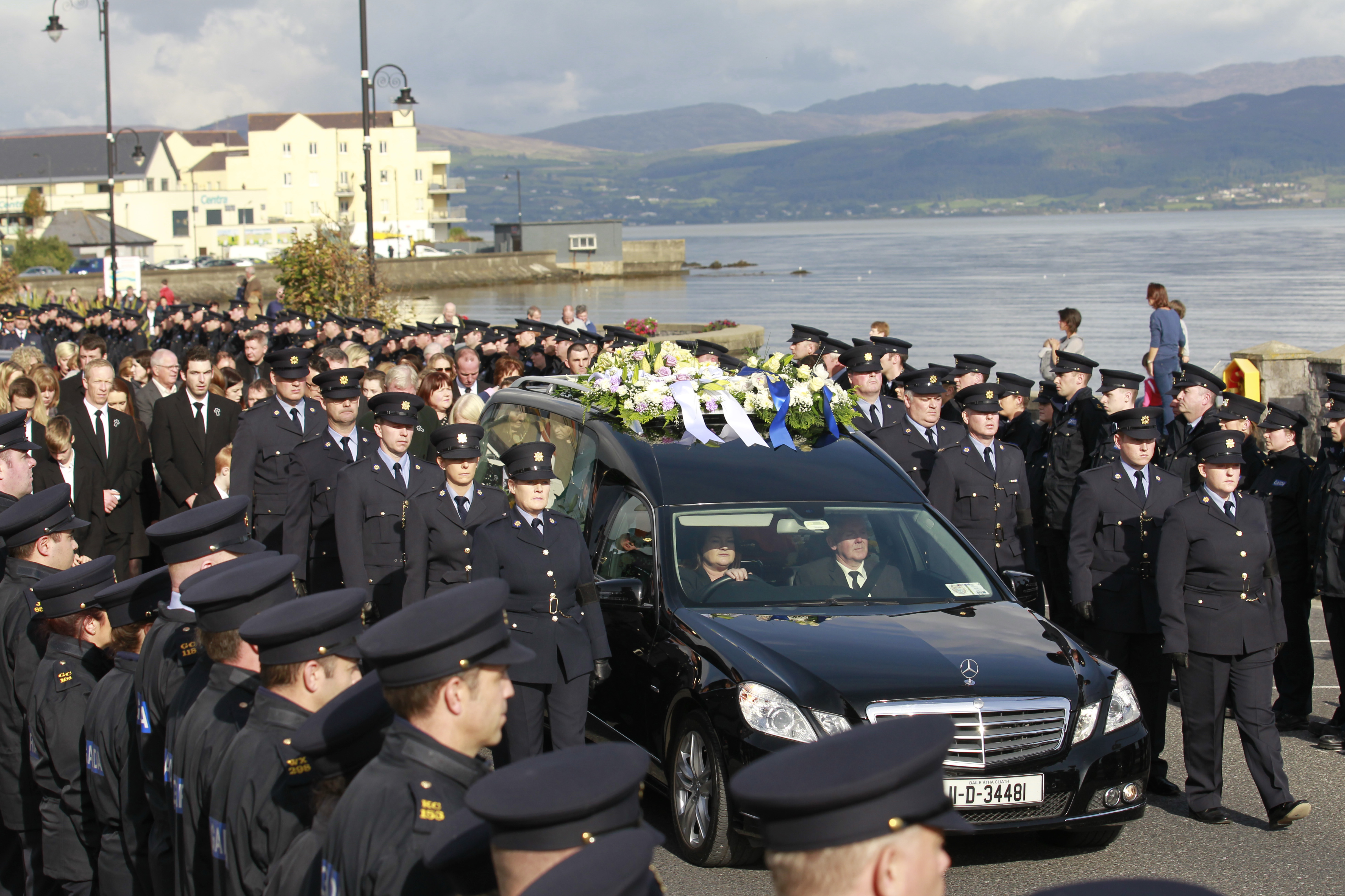 Thousands mourn policeman killed in Irish border village