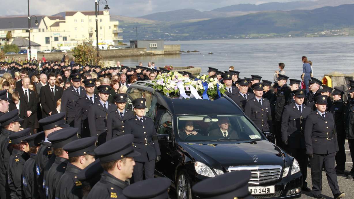 Thousands mourn policeman killed in Irish border village