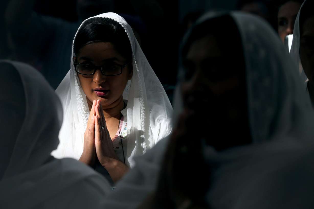 A prayer is recited before the international Sihk community shares the Langar at the Parliament of the World's Religions at the Salt Palace Convention Center in Salt Lake City on Friday, Oct. 16, 2015.
(Photo: Laura Seitz, Deseret News)