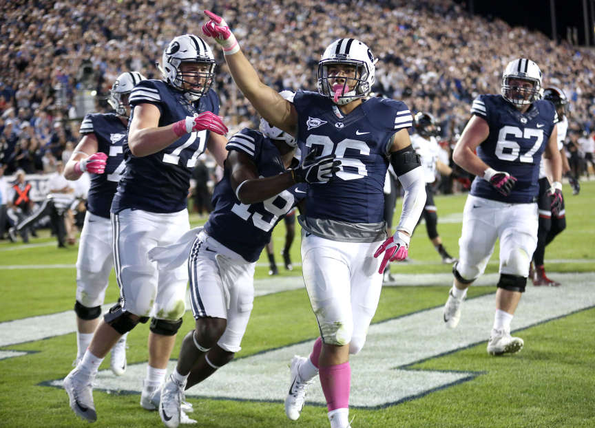 Francis Bernard (36) celebrates his touchdown during a football game against the Cincinnati Bearcats at the LaVell Edwards Stadium in Provo Friday, Oct. 16, 2015. (Photo: Kristin Murphy, Deseret News)