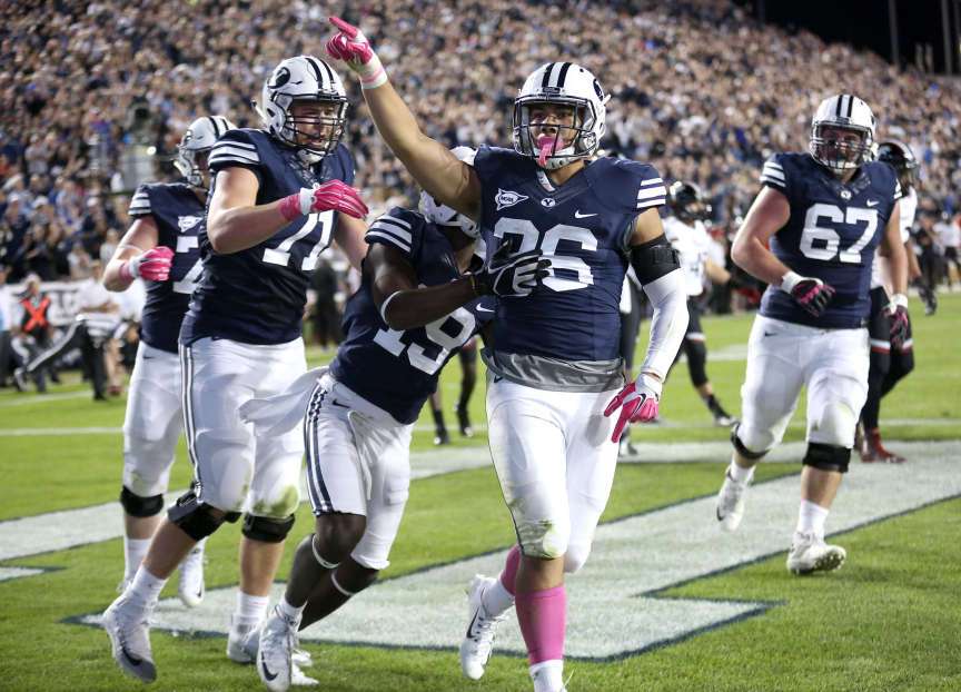 Francis Bernard (36) celebrates his touchdown during a football game against the Cincinnati Bearcats at the LaVell Edwards Stadium in Provo Friday, Oct. 16, 2015. (Photo: Kristin Murphy, Deseret News)