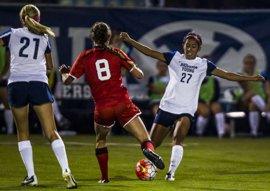 Utah's Kaycee Buckley (8) and BYU's Elena Medeiros (27) attack the ball during a women's soccer game at BYU in Provo on Sept. 4, 2015. (Photo: Stacie Scott, Deseret News)