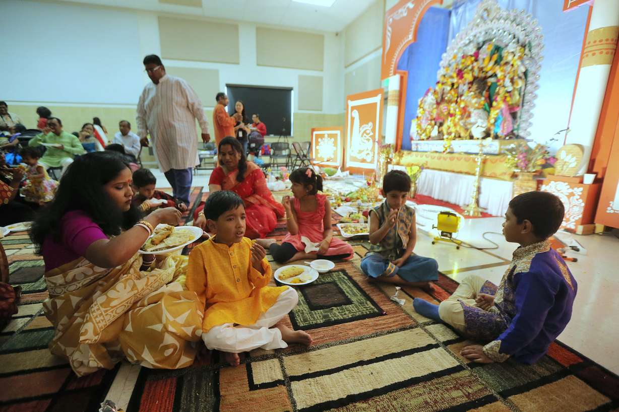Shreyoshi Sen makes sure her son Rajit gets some food as members of the Bengali community gather Sunday, Oct. 18, 2015, for the second of two days for the Durga Puja celebration, at the India Cultural Center, in South Jordan. (Photo: Scott G Winterton, Deseret News)