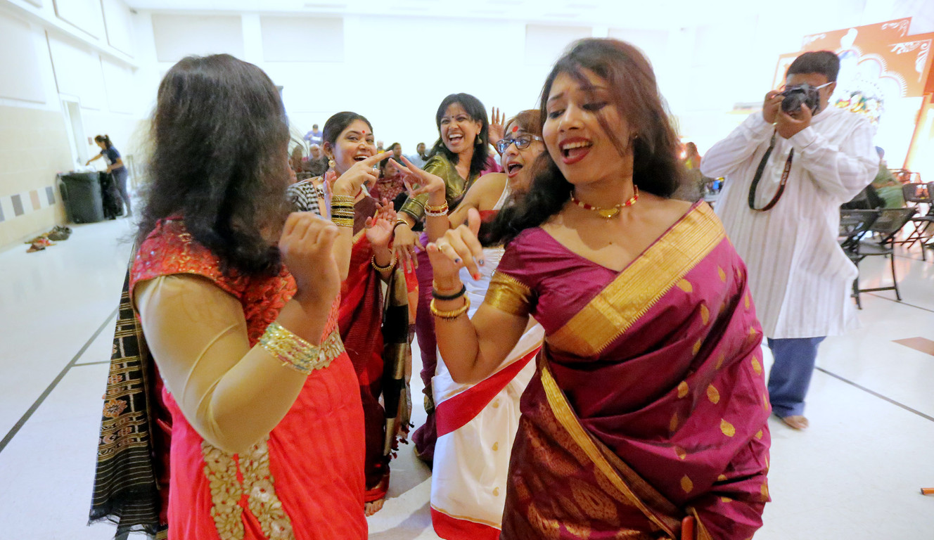 A group of women dance and sing as members of the Bengali community gather Sunday, Oct. 18, 2015, for the second of two days for the Durga Puja celebration, at the India Cultural Center, in South Jordan. (Photo: Scott G Winterton, Deseret News)
