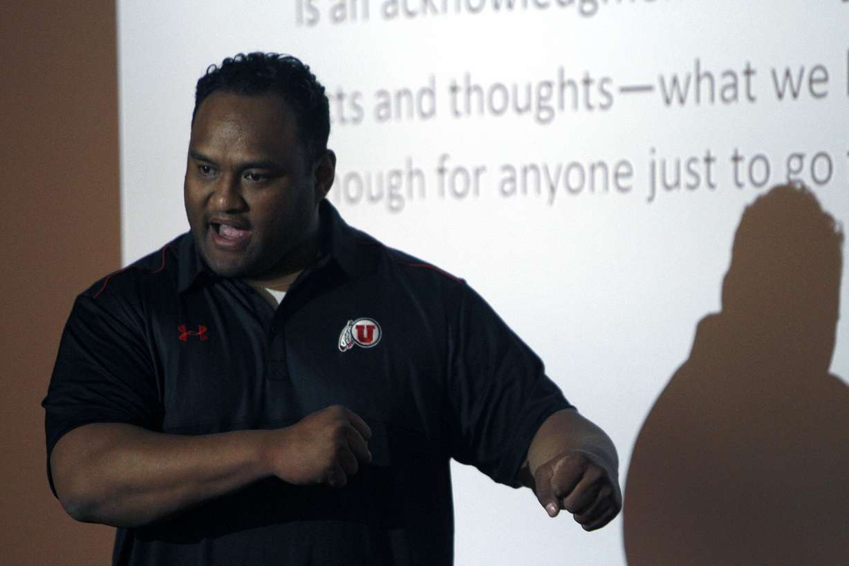 Defensive assistant Sione Pouha led Utah football players in post-practice seminary teachings in Salt Lake City. (Photo: Chelsey Allder/Deseret News)