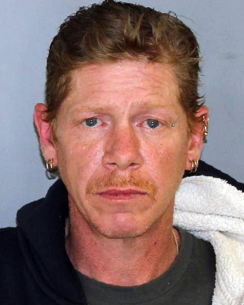 Man accused of killing mom, keeping body in motel for weeks