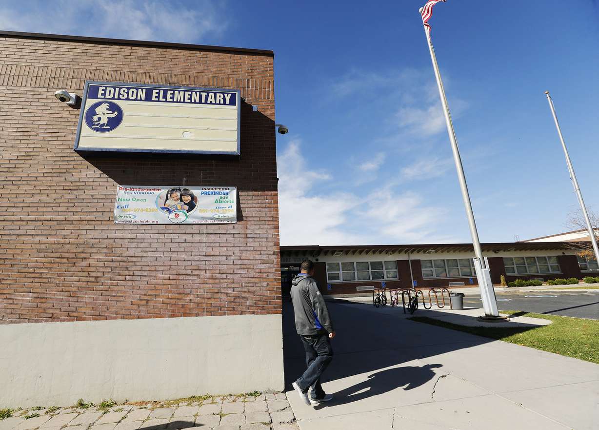 A man walks around Edison Elementary School during lock down in Salt Lake City Tuesday, Oct. 27, 2015. Police spotted an individual on a bike heading toward the school with a gun and attempted to go inside the school. (Photo: Jeffrey D. Allred, Deseret News)