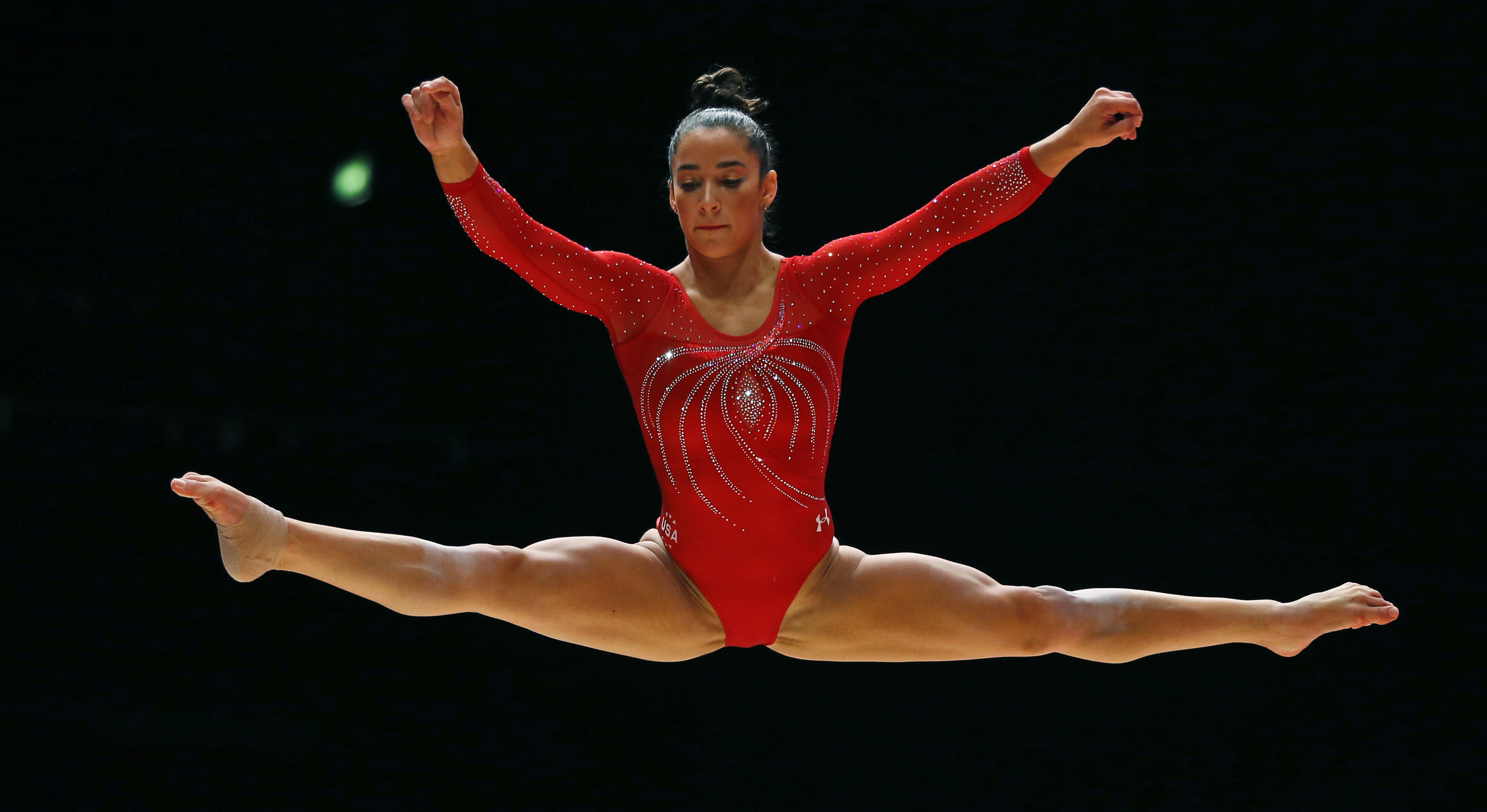 US women roll to 3rd straight world gymnastics title