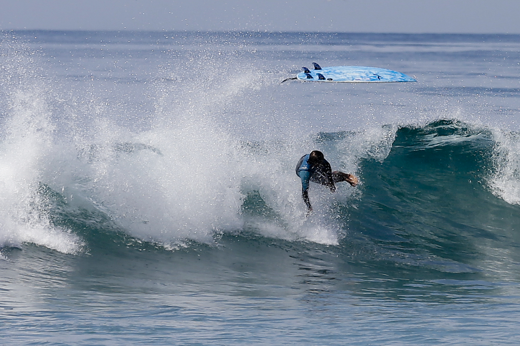 The Latest: Swells in Hawaii, California likely connected