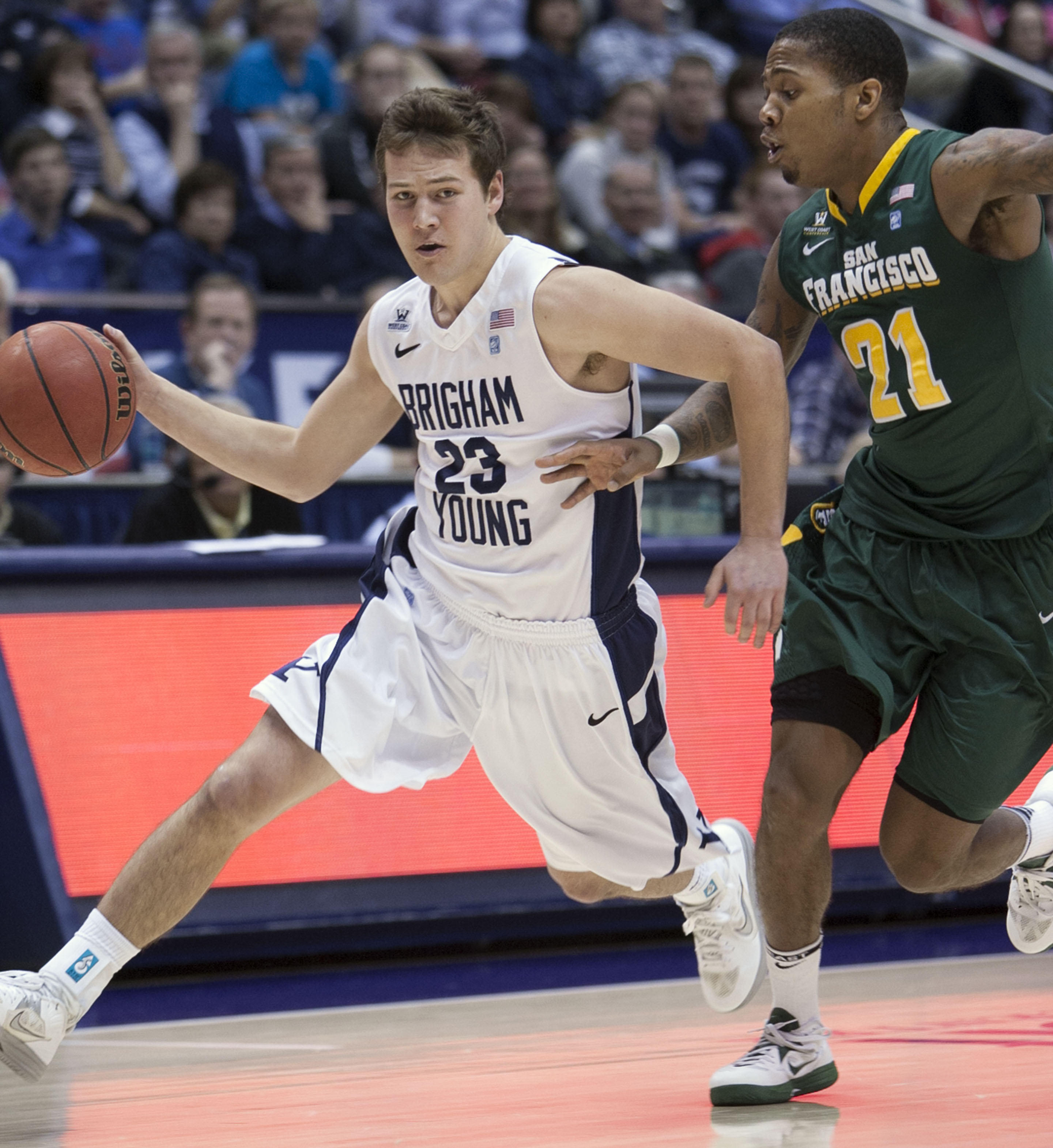 BYU's Cory Calvert tries to drive around De'End Parker as BYU and San Francisco play Feb. 9, 2013 in the Marriott Center. (Photo: Scott G Winterton, Deseret News)