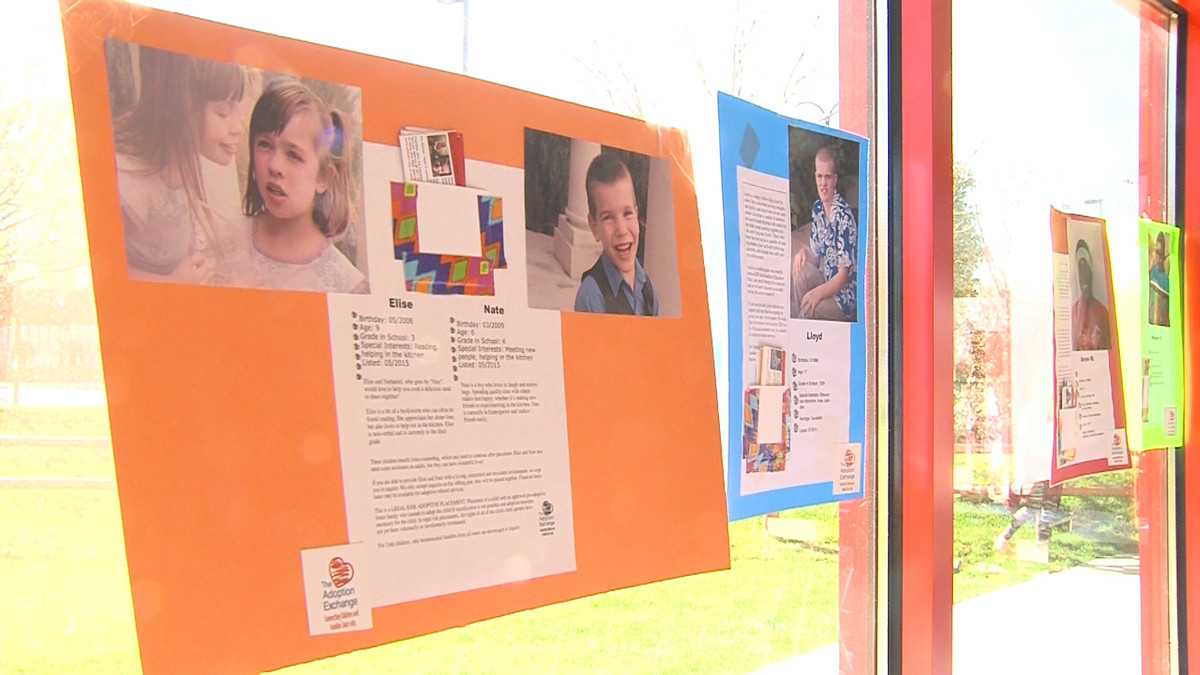 Instead of signs or streamers, Adoption Celebration organizers decorated the walls at Boondocks Fun Center with pictures children living in foster care. The hope was for those visiting the Fun Center to consider adoption for their own families. (Photo: Ray Boone, KSL-TV)
