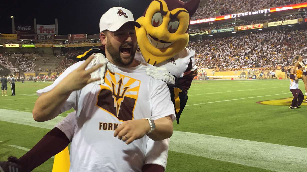 Official seeks $123,000 after university mascot jumps on him