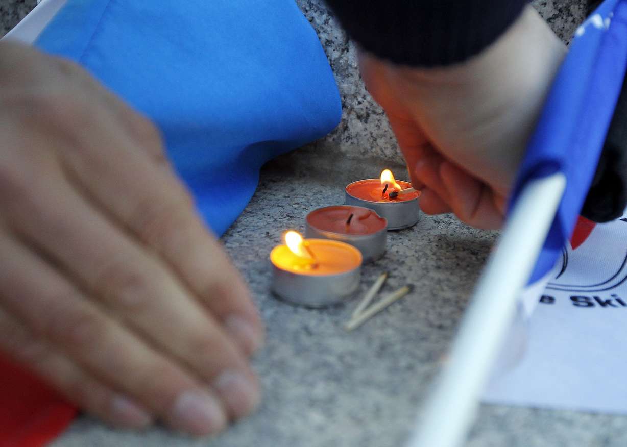 Candles are lit at a vigil to honor of the victims of the terrorist attacks in Paris at the Capitol in Salt Lake City on Sunday, Nov. 15, 2015. (Photo: Chris Samuels, Deseret News)
