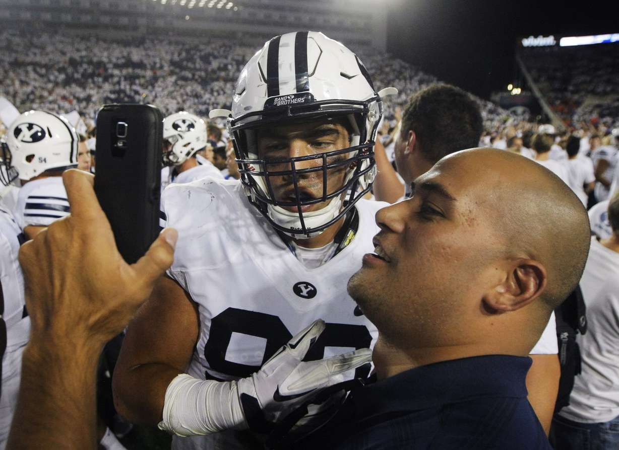 BYU defensive lineman Bronson Kaufusi (90) poses for a selfie as BYU defeats Boise State on Sept. 12, 2015, at LaVell Edwards Stadium in Provo. (Photo: Scott G Winterton, Deseret News)