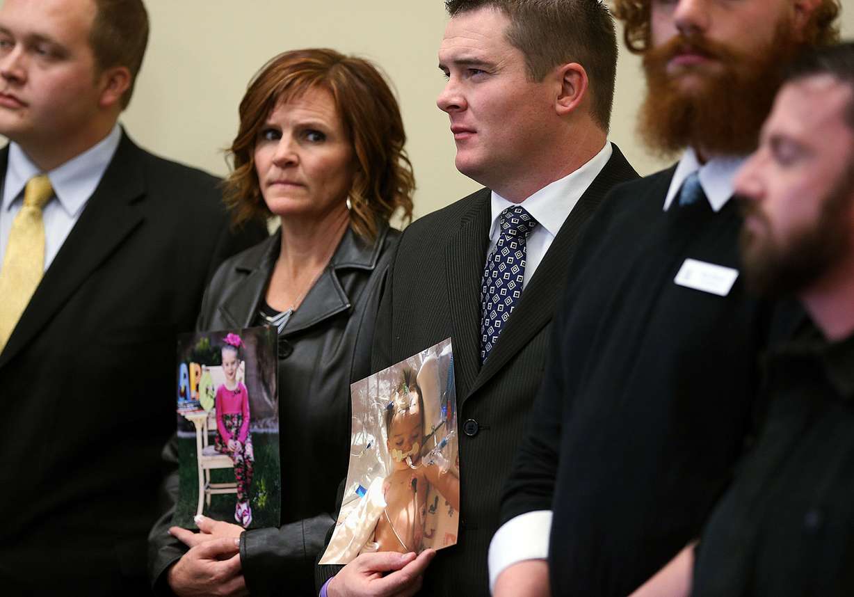 Paul Hill and his sister Nicole Fox hold photos of Paul's daughter Sophie during a press conference at the Capitol in Salt Lake City, Wednesday, Nov. 18, 2015, to promote the establishment of a medical cannabis program in Utah. Hill says his daughter benefits from the use of cannabidiol in treating her seizures. (Ravell Call, )