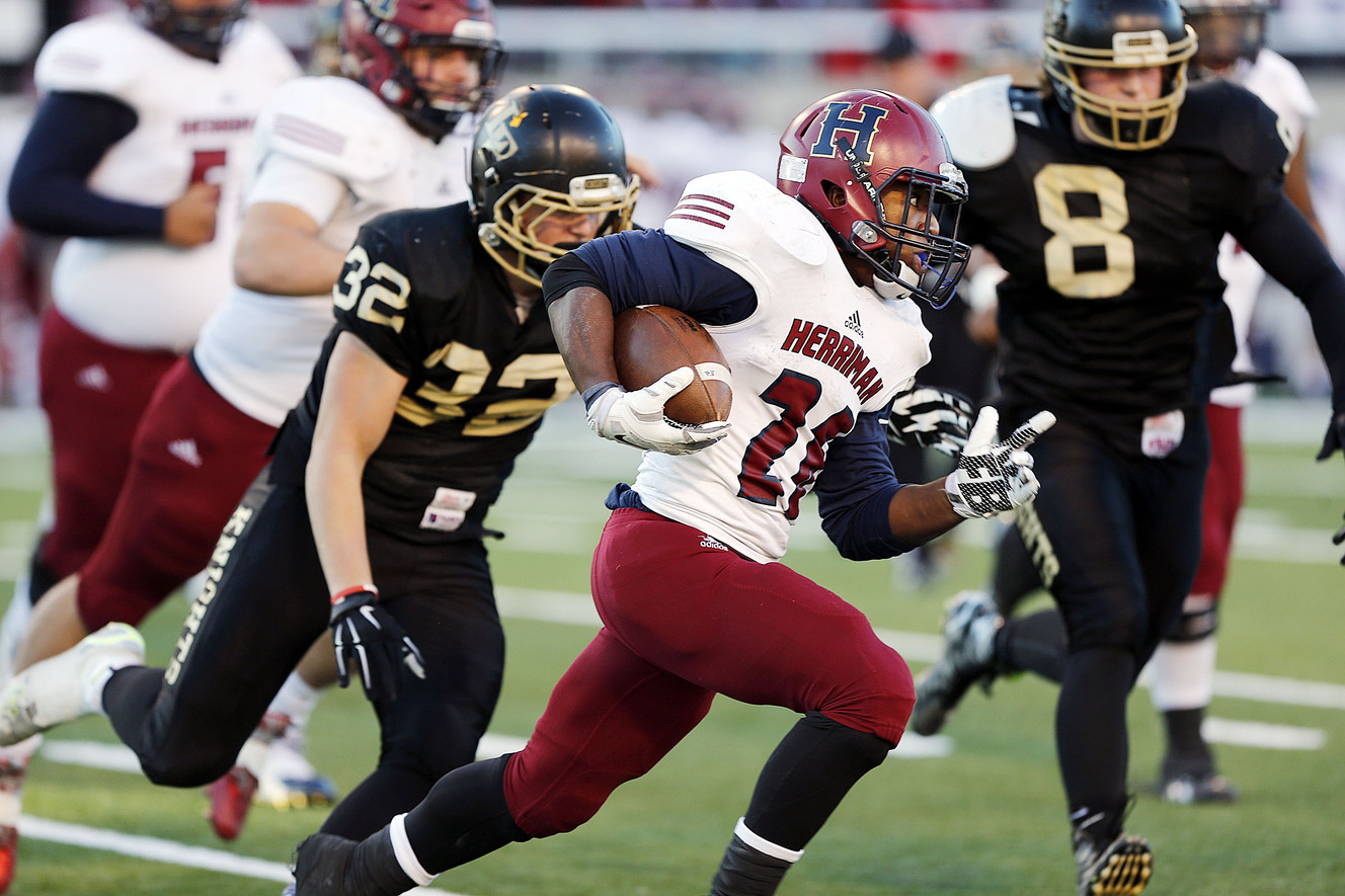 Herriman's Jake Jutkins runs the ball against Lone Peak in the 5A high school state championship football game in Salt Lake City, Friday, Nov. 20, 2015. (Photo: Ravell Call, Deseret News)