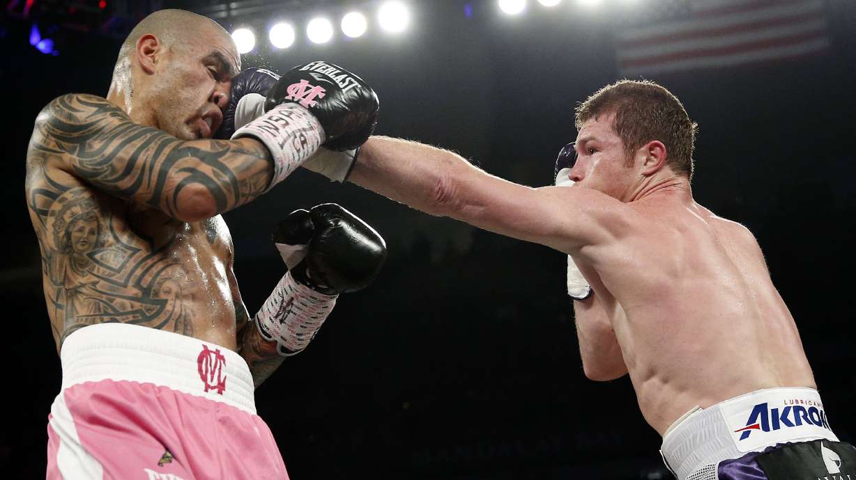 Alvarez takes middleweight title over Cotto
