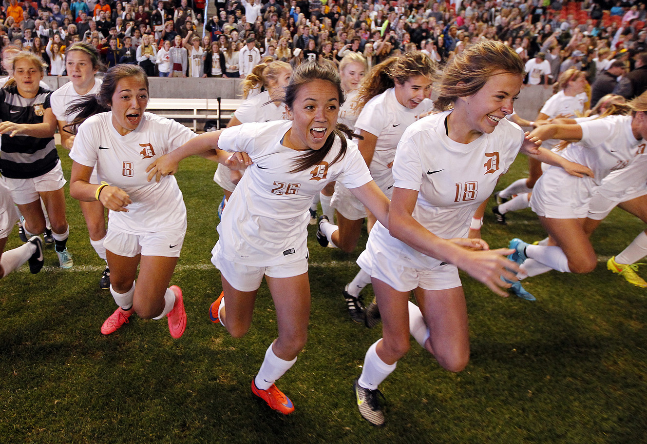 The Davis bench storms the field at the final whistle as they win the Class 5A high school girl's soccer championship at Rio Tinto Stadium in Sandy, Oct. 23, 2015. (Photo: Chris Samuels, Deseret News)
