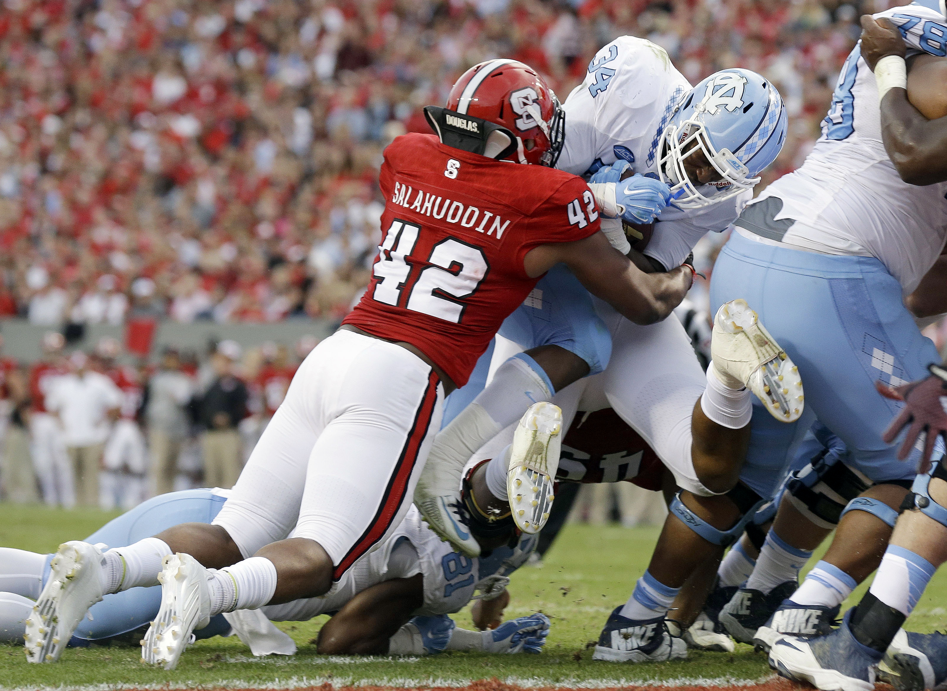 No. 11 UNC beats rival NC State 45-34 for 11th straight win