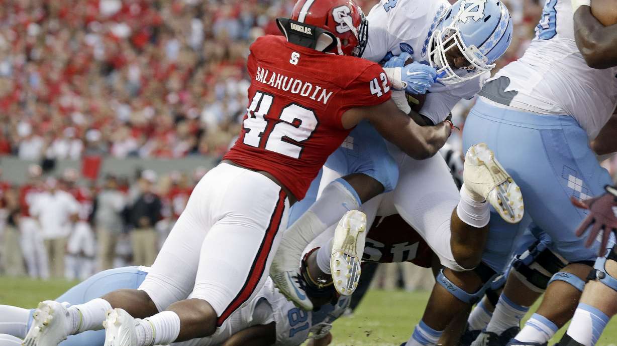 No. 11 UNC beats rival NC State 45-34 for 11th straight win