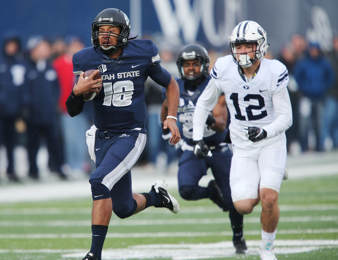 Utah State quarterback Chuckie Keeton (16) runs for a touchdown against BYU defensive back Kai Nacua (12) in Logan, Nov. 28, 2015. (Photo: Jeffrey D. Allred, Deseret News)