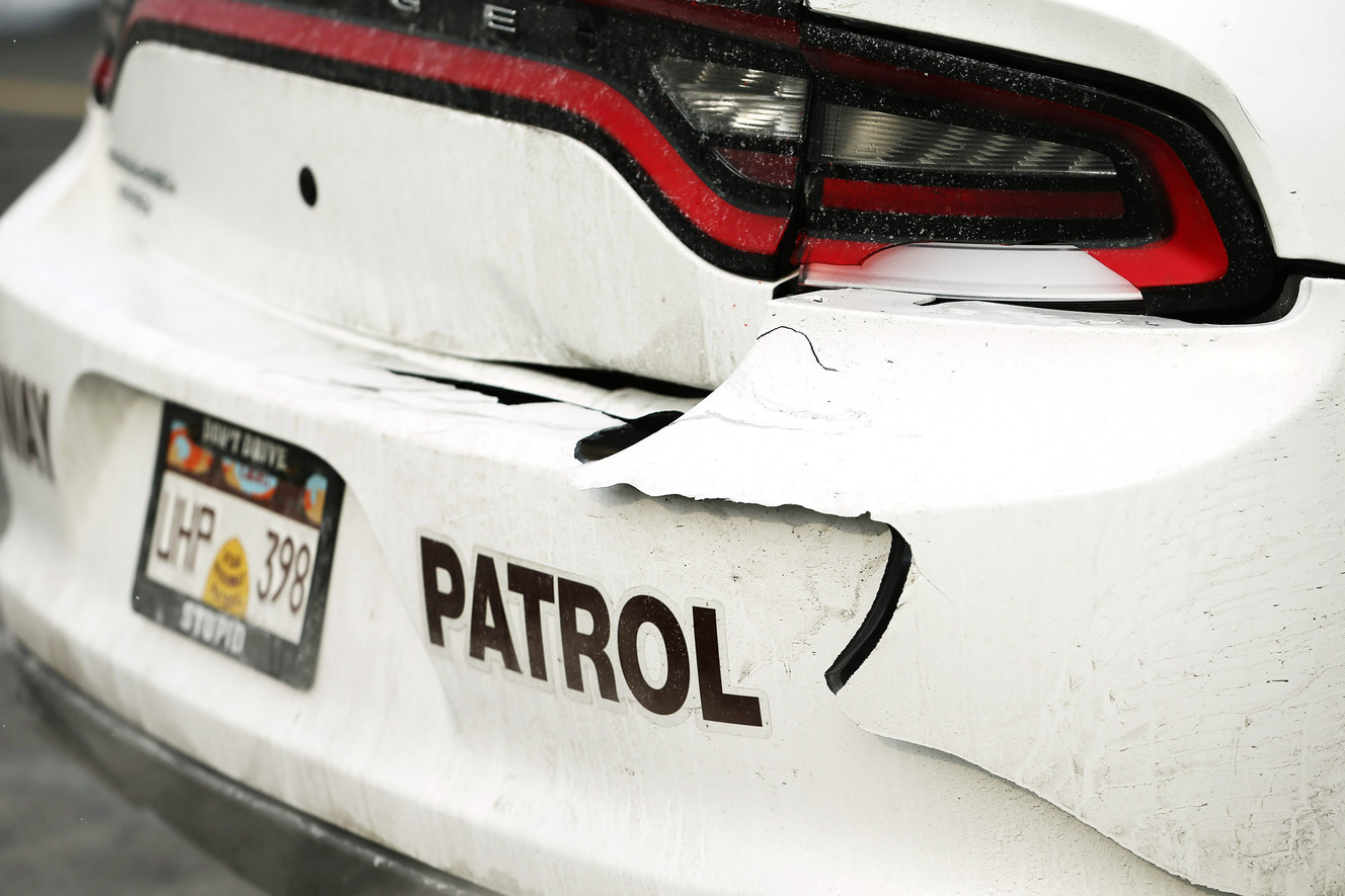Damage to Utah Highway Patrol trooper Andy Battenfield's car is shown Sunday, Nov. 29, 2015. Battenfield's vehicle was hit by an SUV on I-15 over the weekend, and he talked about the need for safety on the roads. (Photo: Scott G Winterton, Deseret News)