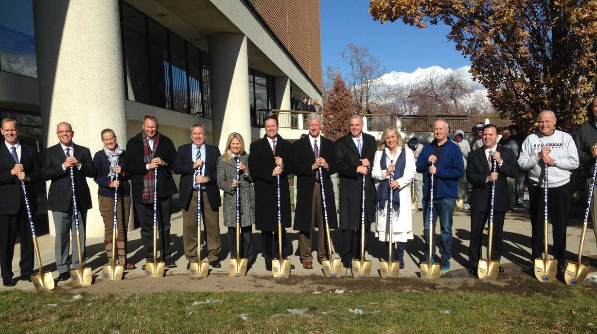 BYU head coach Dave Rose and school president Kevin J. Worthen, center, break ground with several donors and facility representatives during the groundbreaking ceremony of the Marriott Center Annex in Provo, Monday, Nov. 30, 2015. (Photo: Sean Walker, KSL.com)
