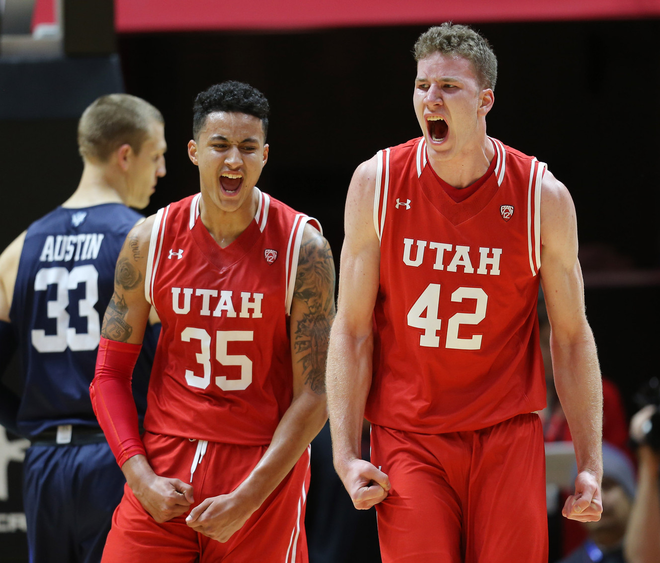Utah Utes forward Kyle Kuzma (35) and Utah Utes forward Jakob Poeltl (42) celebrate after a basket and foul as Utah and BYU play in the Huntsman Center in Salt Lake City Wednesday, Dec. 2, 2015. (Photo: Scott G. Winterton/Deseret News)