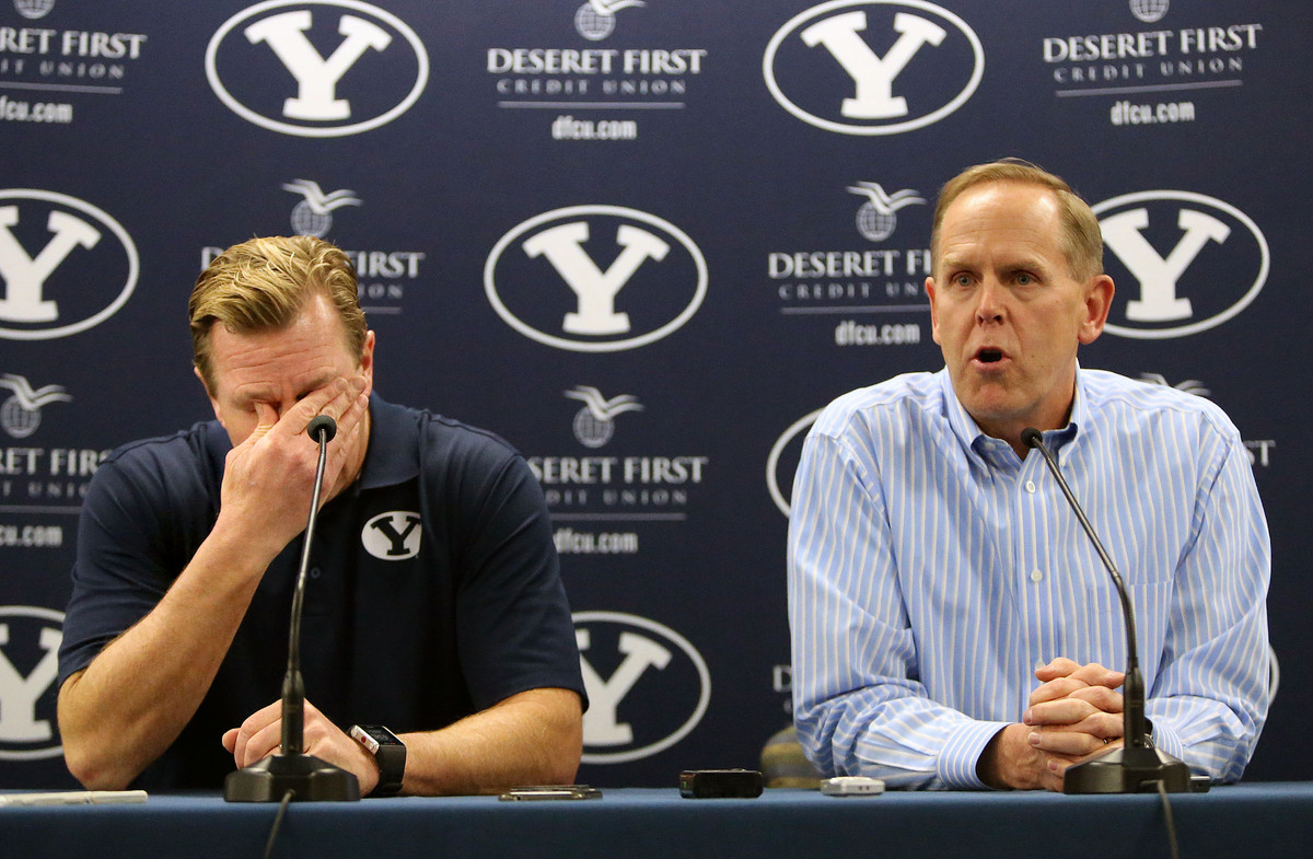 Bronco Mendenhall gets emotional as athletic director Tom Holmoe talks about Mendenhall leaving BYU to take over for Mike London at Virginia after 11 years as BYU's head football coach during a press conference at BYU in Provo on Dec. 4, 2015. (Photo: Kristin Murphy, Deseret News)