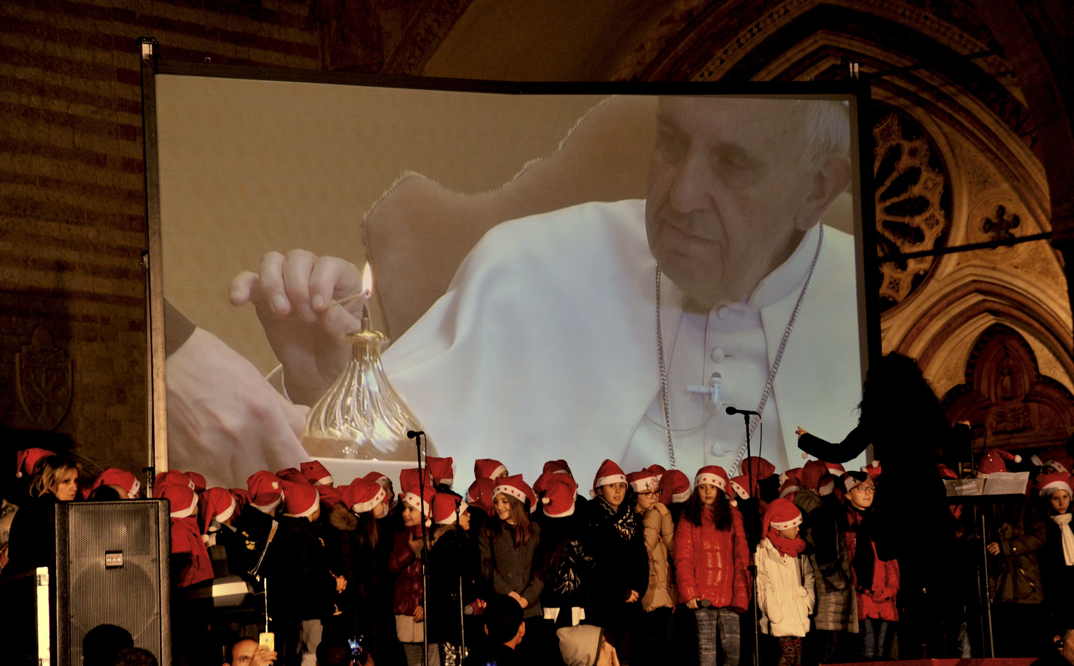 Pope symbolically lights Assisi Christmas tree for migrants
