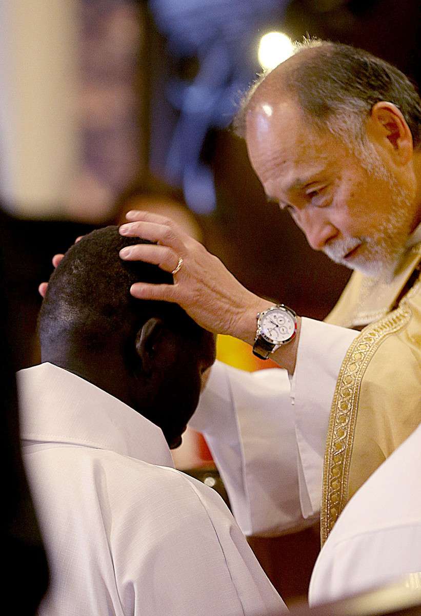 The Right Rev. Scott Hayashi ordains Gabriel Atem as a Deacon within the Episcopal Church at the Cathedral Church of Saint Mark in Salt Lake City on Saturday, Dec. 5, 2015. (Photo: Laura Seitz, Deseret News)