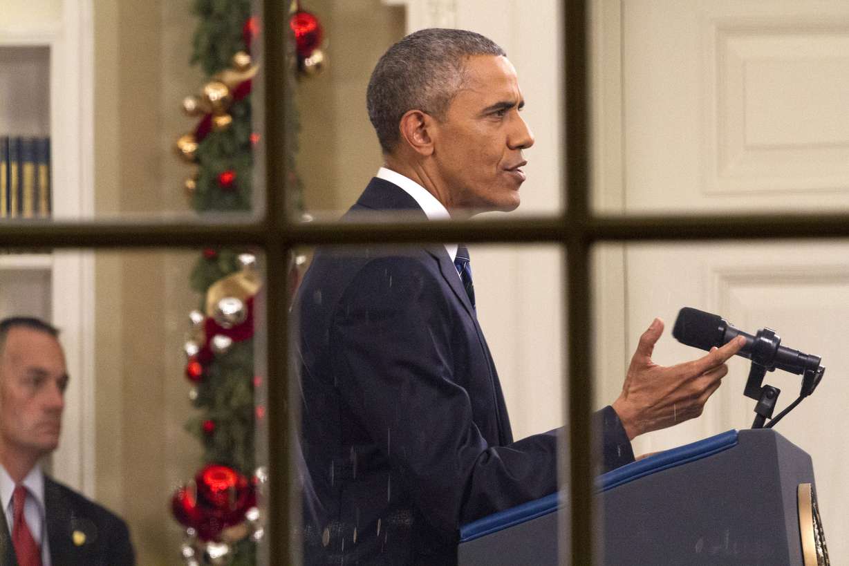 President Barack Obama addresses the nation from the Oval Office at the White House in Washington, Sunday night, Dec. 6, 2016. Photo: AP Phot