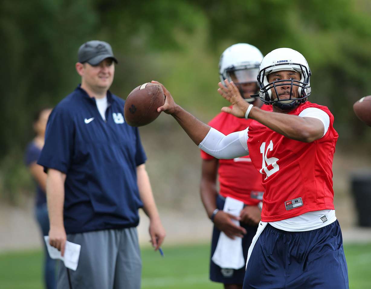 Utah State offensive coordinator Josh Heupel watches quarterback Chuckie Keeton during football practice Aug. 7, 2015, in Logan. (Photo: Tom Smart, Deseret News)