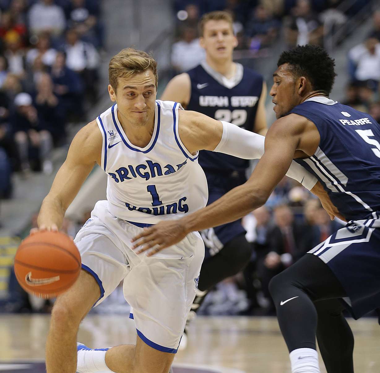 BYU guard Chase Fischer (1) drives on Utah State guard Julion Pearre (5) as BYU and Utah State play at the Marriott Center in Provo, Dec. 9, 2015. (Photo: Scott G Winterton, Deseret News)