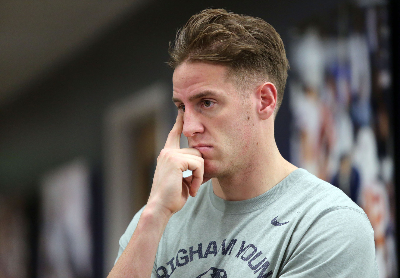 BYU wide receiver Mitch Mathews listens as Bronco Mendenhall talks about leaving BYU to take over for Mike London at Virginia after 11 years as BYU's head football coach during a press conference at BYU in Provo on Dec. 4, 2015. (Photo: Kristin Murphy, Deseret News)