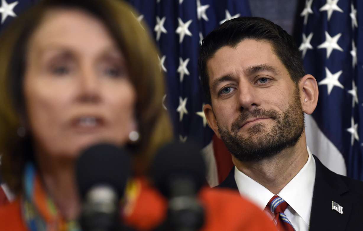 House Speaker Paul Ryan of Wis. listens as House Minority Leader Nancy Pelosi of Calif. speaks on Capitol Hill in Washington, Wednesday, Dec. 9, 2015. Photo: AP Photo