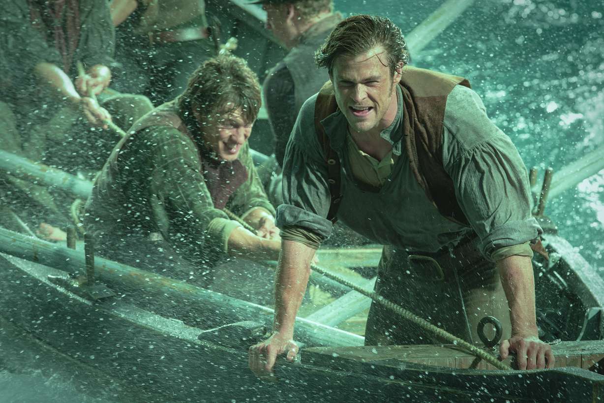 This photo provided by Warner Bros. Pictures shows, Chris Hemsworth, right, as Owen Chase, and Sam Keeley as Ramsdell, left, in a scene from the film, "In the Heart of the Sea." The movie opens in U.S. theaters on Dec. 11, 2015. (Jonathan Prime/Warner Bros. Pictures via AP)