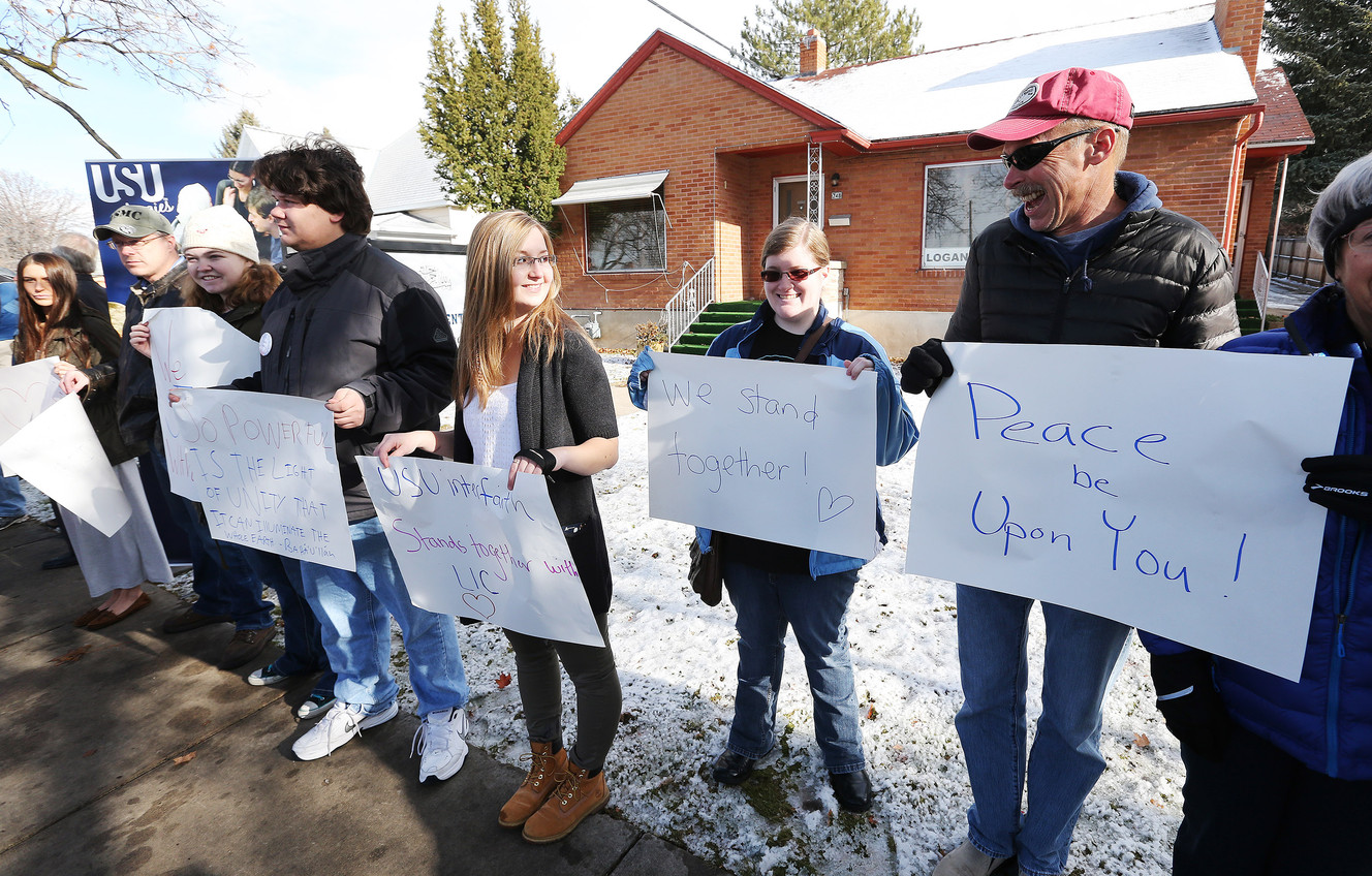 Members of the public hold signs during a "Standing Together" vigil at the Logan Islamic Center in Logan on Friday, Dec. 11, 2015. The vigil was held to show support for Cache Valley Muslims. (Photo: Jeffrey D. Allred, Deseret News)