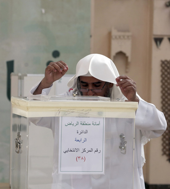 A Saudi man casts his ballot at a polling center during the municipal elections in Riyadh, Saudi Arabia, Saturday, Dec. 12, 2015. (AP Photo/Khalid Mohammed)