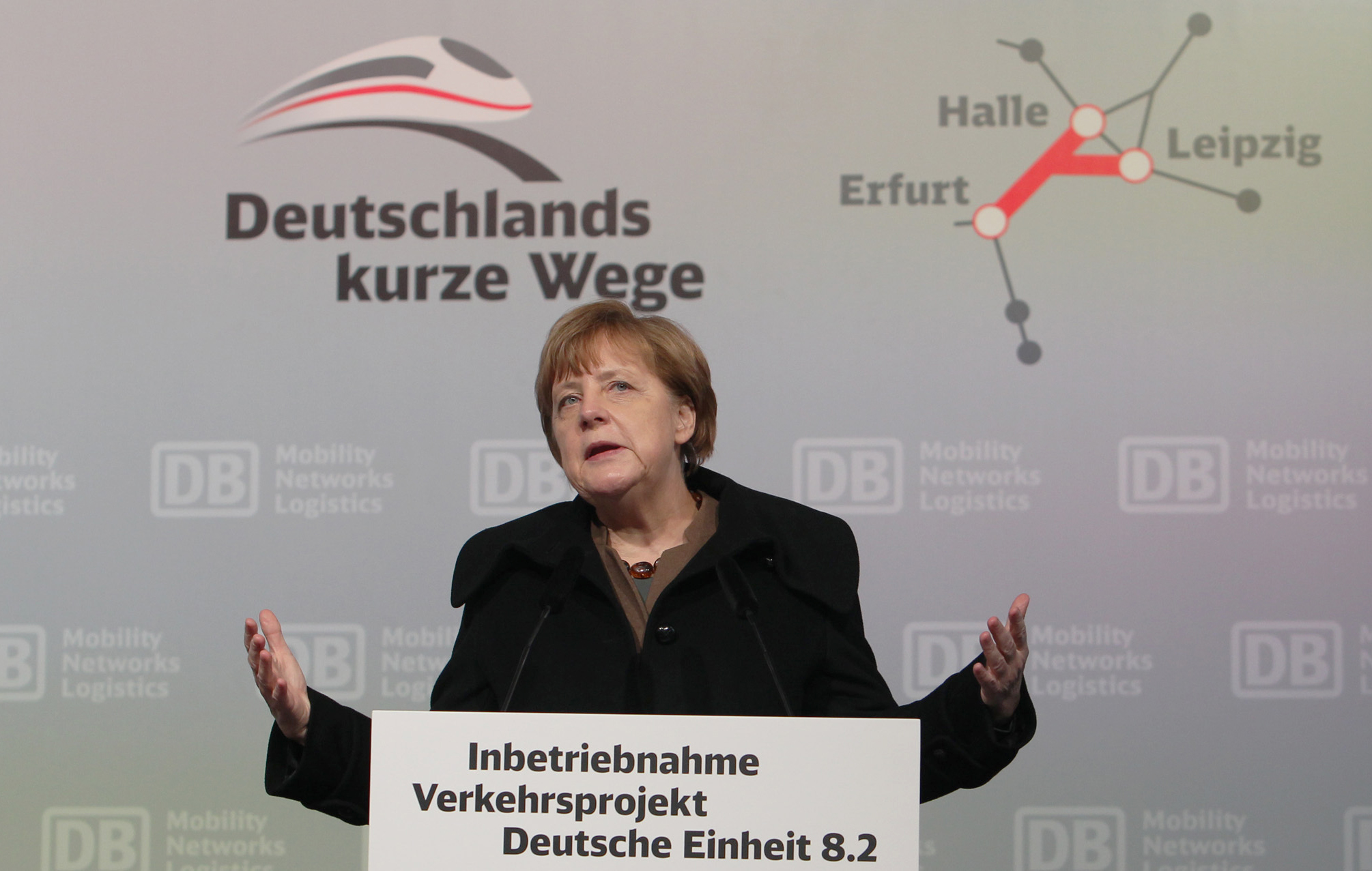 The Latest: Merkel against set limit to number of migrants