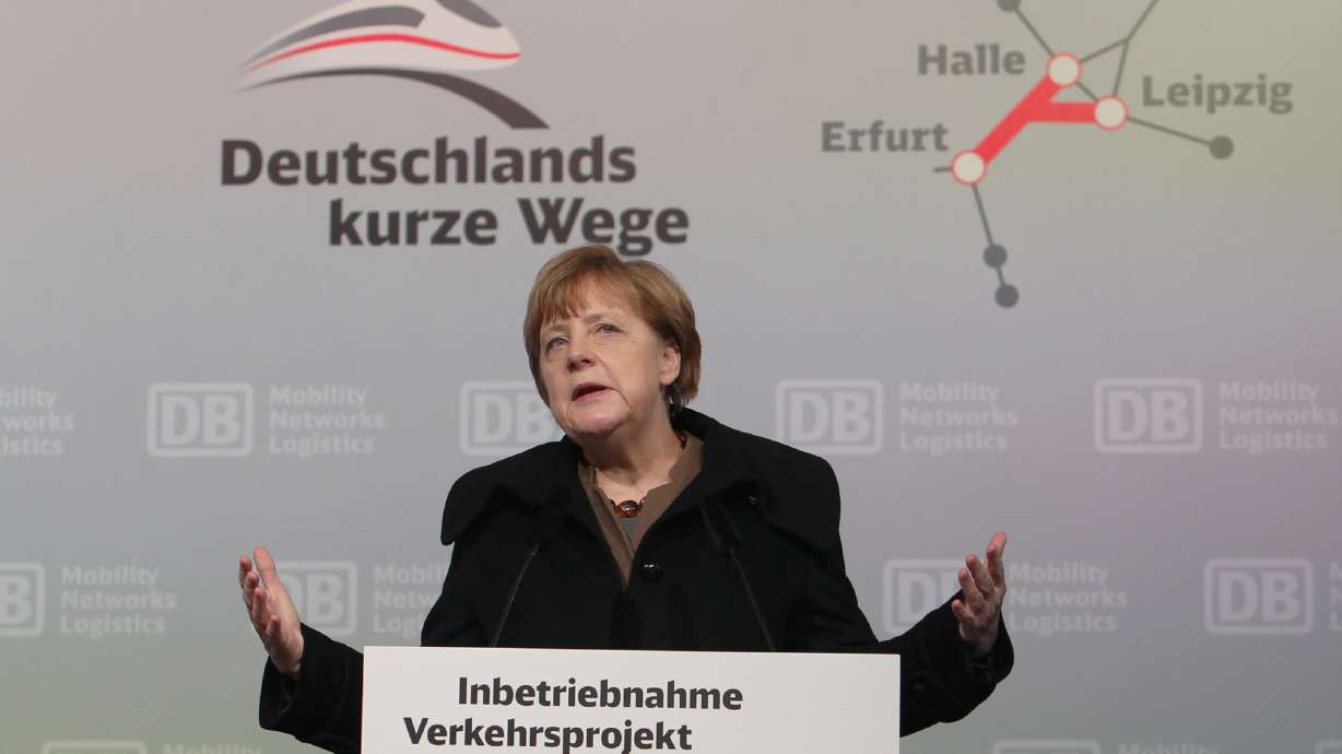 The Latest: Merkel against set limit to number of migrants