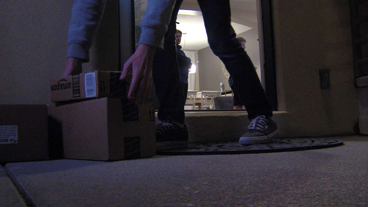 Residents in the Daybreak community hope placing fake packages on their front porches will deter thieves. (Photo: Nkoyo Iyamba)