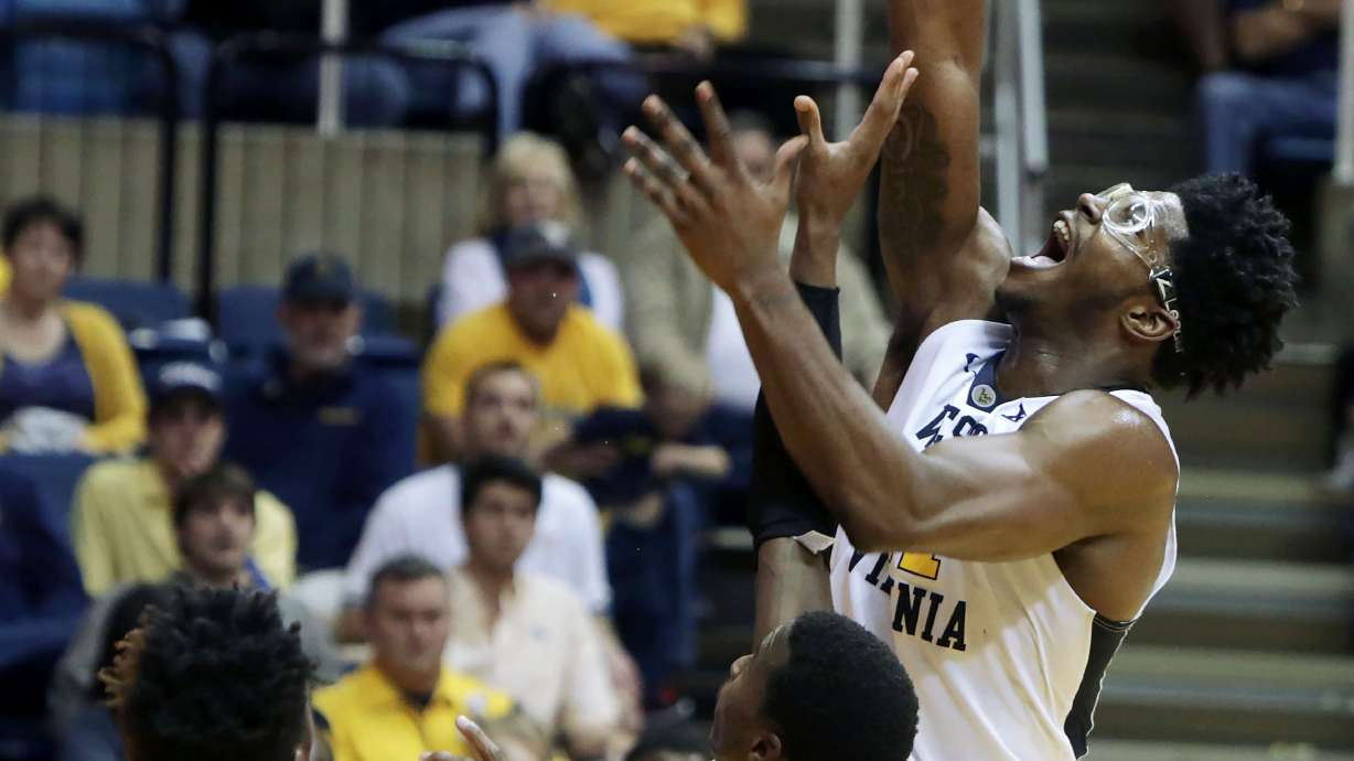 Carter scores 21 as No. 14 West Virginia routs ULM 100-58