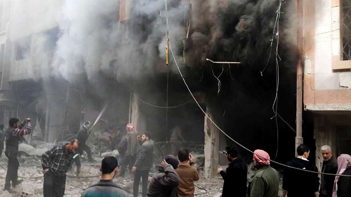 The Latest: Syria troops seize air base in rebel-held suburb