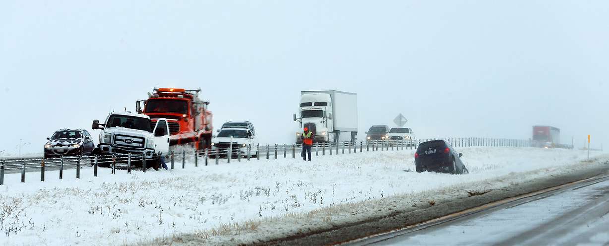 A car sits in the median on I-80, on the west side of the Salt Lake Valley, after a large winter storm dumped snow along the Wasatch Front on Monday, Dec. 14, 2015. (Photo: Scott G Winterton, Deseret News)