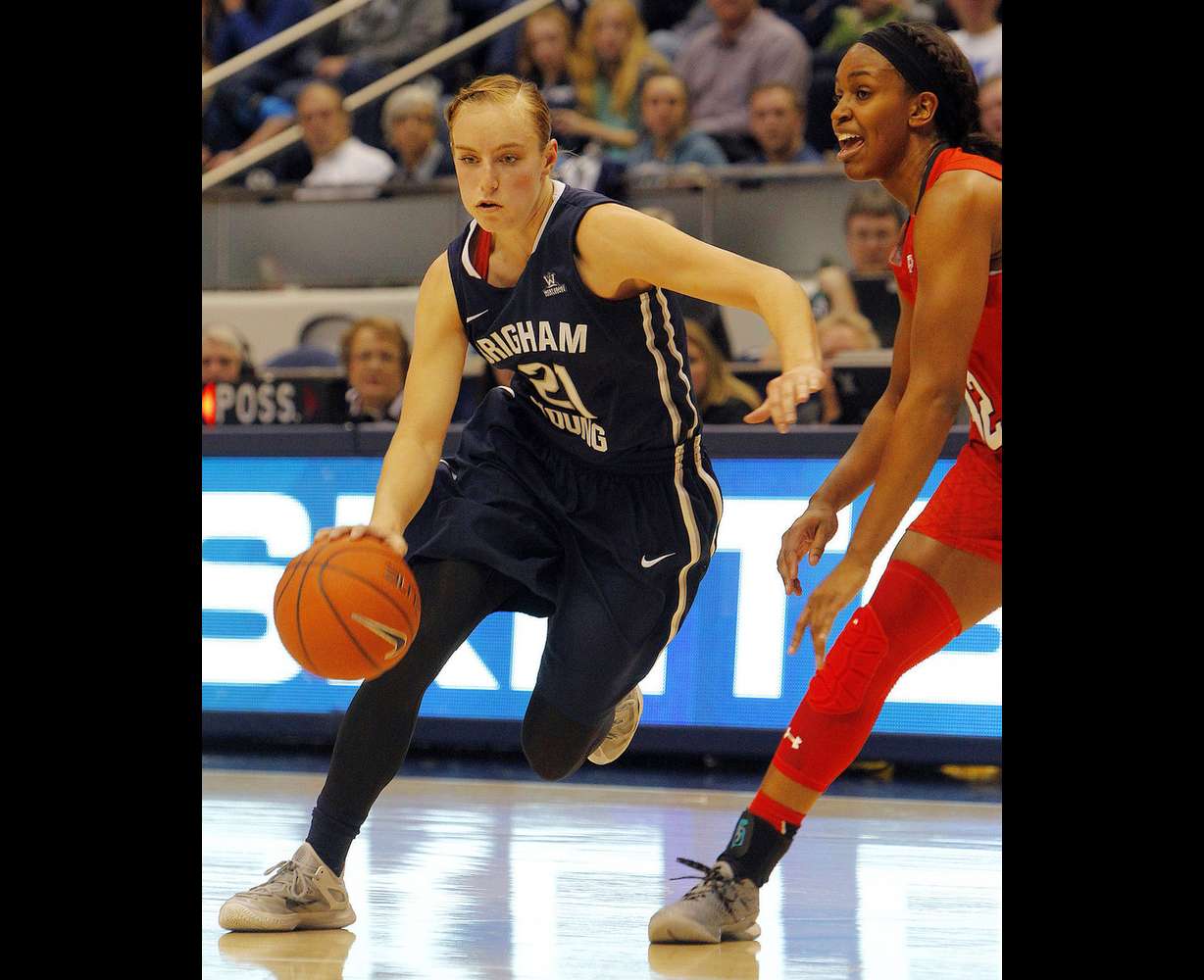 BYU guard Lexi Eaton Rydalch (21) tries to cut around a defender in an NCAA women's basketball game against Utah at the Marriott Center in Provo, Dec. 12, 2015. (Photo: Chris Samuels, Deseret News)