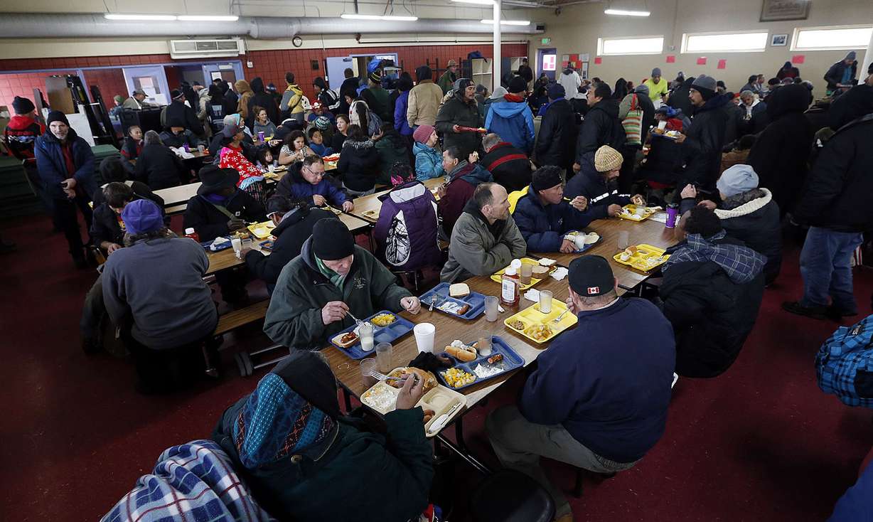 People eat lunch at Catholic Community Services' St. Vincent DePaul Dining Hall in Salt Lake City on Monday, Dec. 14, 2015. (Photo: Ravell Call, Deseret News)