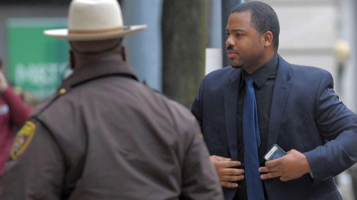 The Latest: Center of former unrest now site of prayers