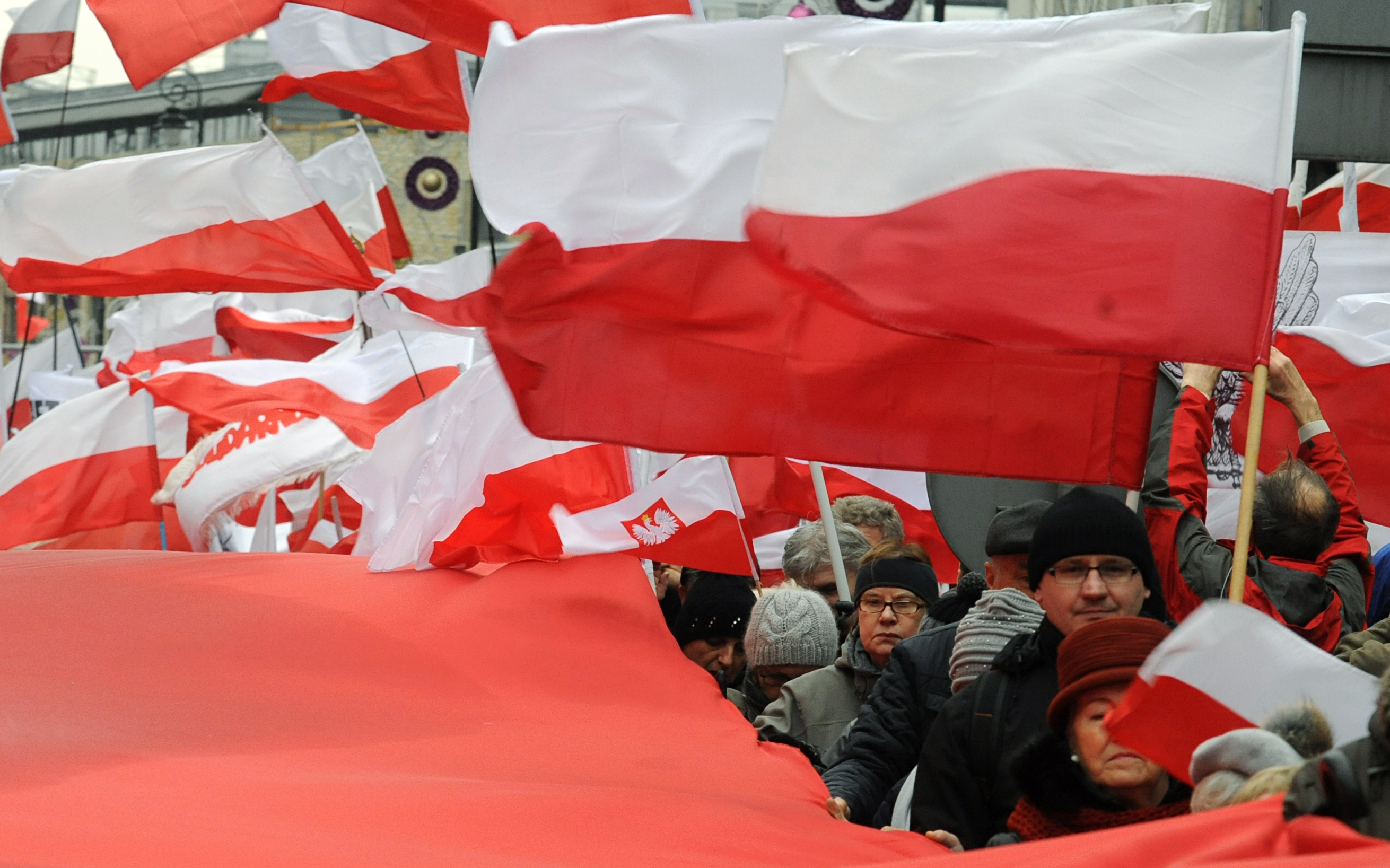 Poland's ruling party tries to solve conflict with new law