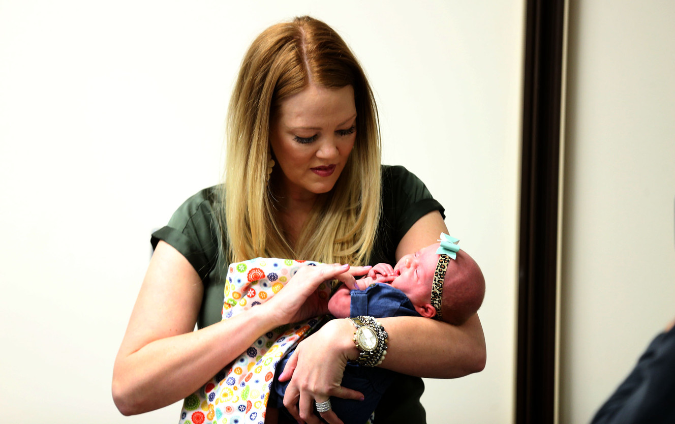 Arlee Gregerson holds her newborn, Lucy, at the Intermountain Medical Center in Murray on Thursday, Dec. 17, 2015. Two days after delivering her first child, Gregerson nearly died. Gregerson returned to the medical center to speak to reporters about her care at the center. (Photo: Laura Seitz, Deseret News)